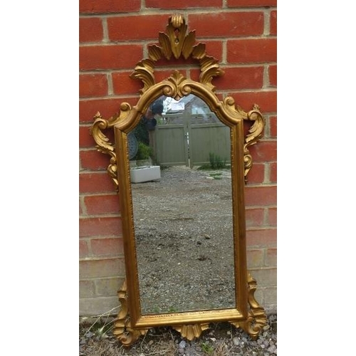 865 - A vintage giltwood Italian wall mirror, in a shaped and pierced surround depicting acanthus leaves. ... 