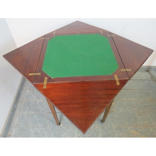 867 - An Edwardian mahogany envelope card table, crossbanded and strung with boxwood and ebony, housing on... 