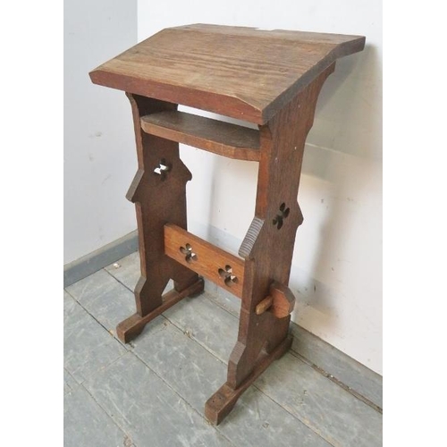 873 - A 19th century ecclesiastical oak lectern/book stand, on stile supports with stretcher featuring pie... 