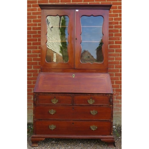 877 - A Georgian mahogany bureau bookcase, the top section with two height-adjustable shelves above three ... 