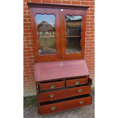 877 - A Georgian mahogany bureau bookcase, the top section with two height-adjustable shelves above three ... 