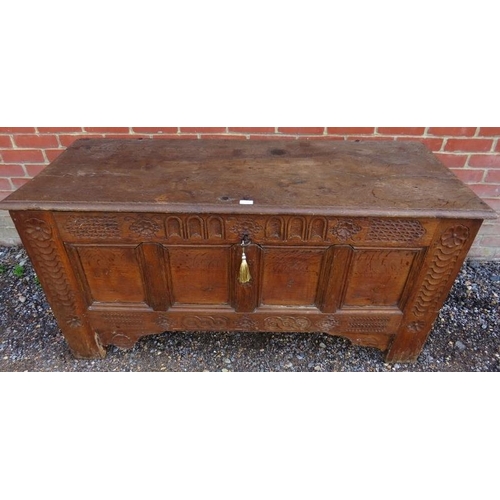 878 - A late 17th/early 18th century panelled medium oak coffer, with twin candle boxes, the front with ch... 