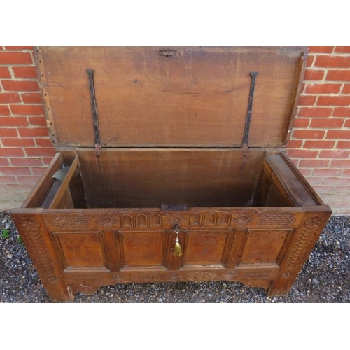 878 - A late 17th/early 18th century panelled medium oak coffer, with twin candle boxes, the front with ch... 