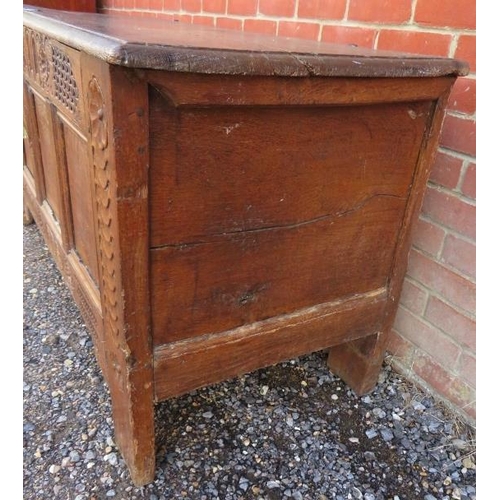 878 - A late 17th/early 18th century panelled medium oak coffer, with twin candle boxes, the front with ch... 