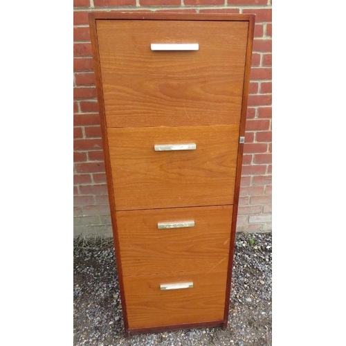 879 - A mid-century teak filing cabinet, housing four deep drawers, on a plinth base. 
H134 W58 D66
Condit... 