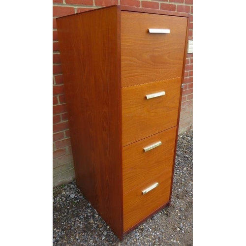 879 - A mid-century teak filing cabinet, housing four deep drawers, on a plinth base. 
H134 W58 D66
Condit... 