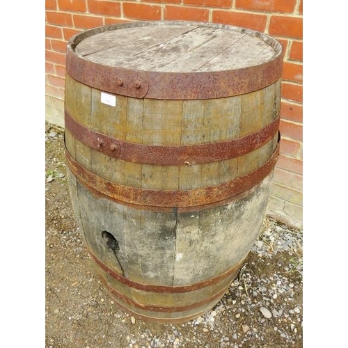 886 - Two antique oak and iron coopered whisky barrels/garden tables. 
H89cm Diameter 59cm (approx).
Condi... 