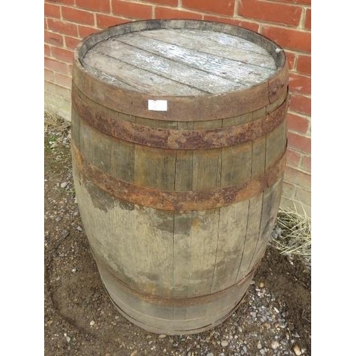 886 - Two antique oak and iron coopered whisky barrels/garden tables. 
H89cm Diameter 59cm (approx).
Condi... 