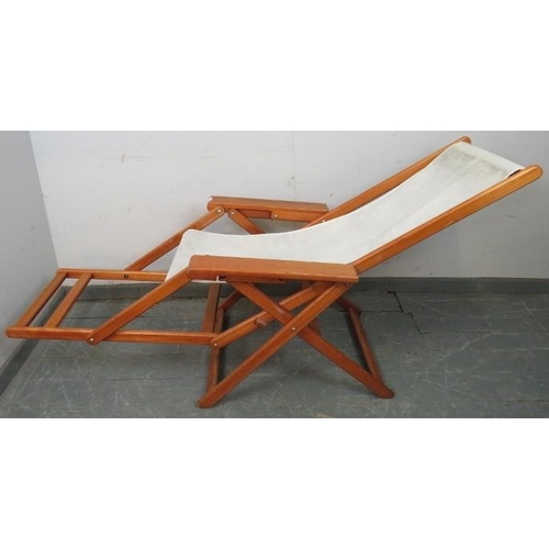 890 - A mid-century plantation style teak folding sun lounger, with footrest. 
H103 W69 D122 (unfolded)
Co... 