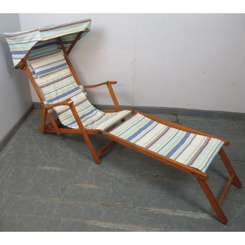 891 - A vintage teak steamer style adjustable deck chair, with canopy and removable footrest, upholstered ... 