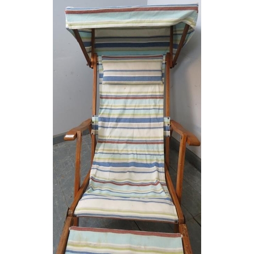 891 - A vintage teak steamer style adjustable deck chair, with canopy and removable footrest, upholstered ... 