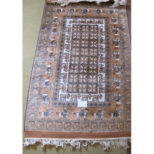 915 - An Afghan rug depicting figures on horseback, moose and wild cats, all on a tan field. 200cm x 119cm... 