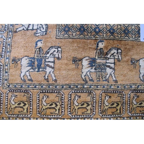 915 - An Afghan rug depicting figures on horseback, moose and wild cats, all on a tan field. 200cm x 119cm... 