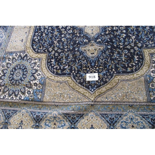 918 - A Persian (Iran) carpet, large central motif blue on fawn ground, good colours and condition. 294cm ... 