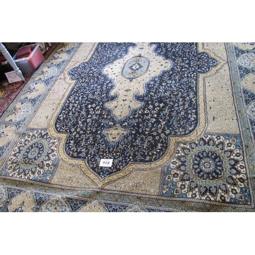 918 - A Persian (Iran) carpet, large central motif blue on fawn ground, good colours and condition. 294cm ... 