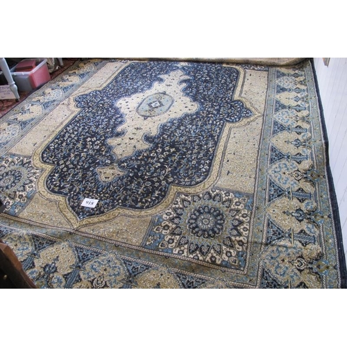 918 - A Persian (Iran) carpet, large central motif blue on fawn ground, good colours and condition. 294cm ... 