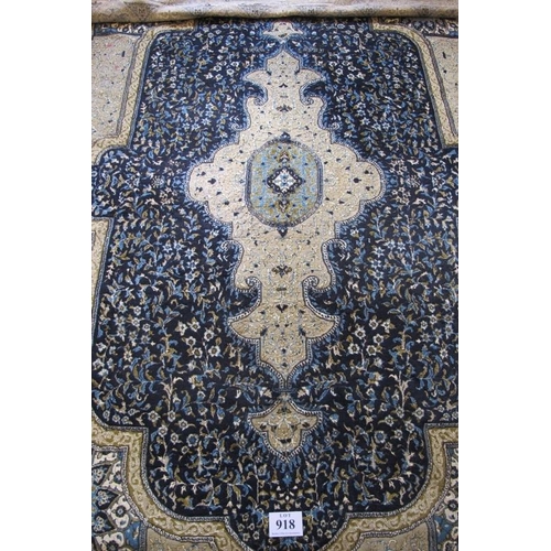 918 - A Persian (Iran) carpet, large central motif blue on fawn ground, good colours and condition. 294cm ... 