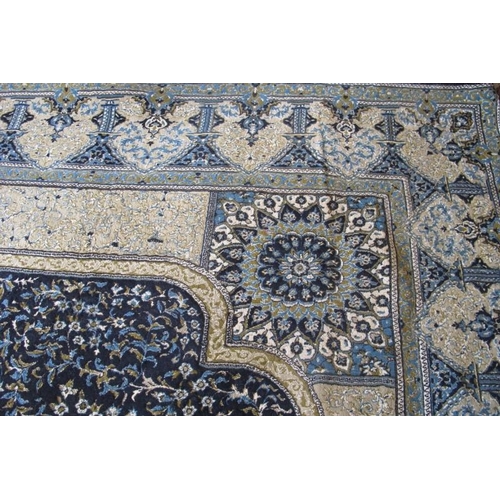 918 - A Persian (Iran) carpet, large central motif blue on fawn ground, good colours and condition. 294cm ... 