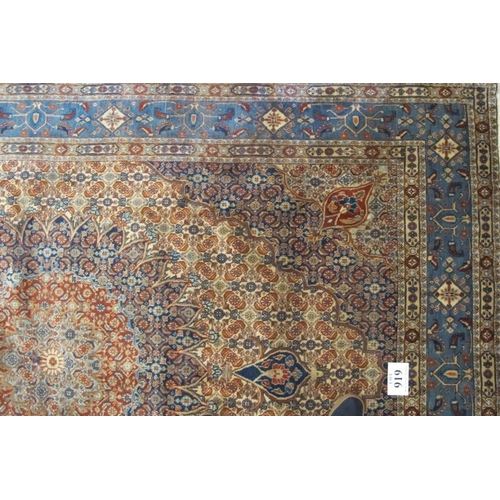 919 - A fine Persian Mood carpet central medallion on tan, blue and orange ground and in good clean condit... 