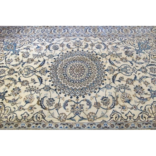 921 - A good Persian fine Nain carpet central round motif blue on cream ground. In very good condition. 31... 