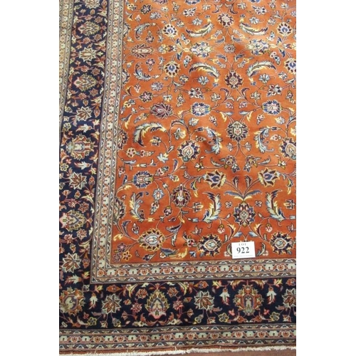 922 - A fine Persian Sarouhn rug with a central block pattern of foliage on salmon pink ground. In good co... 