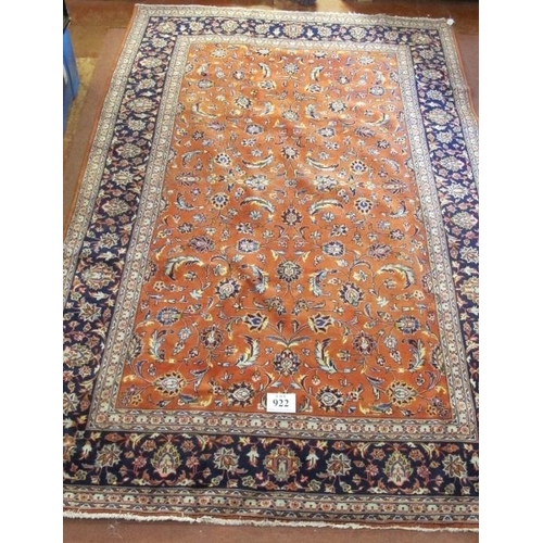 922 - A fine Persian Sarouhn rug with a central block pattern of foliage on salmon pink ground. In good co... 