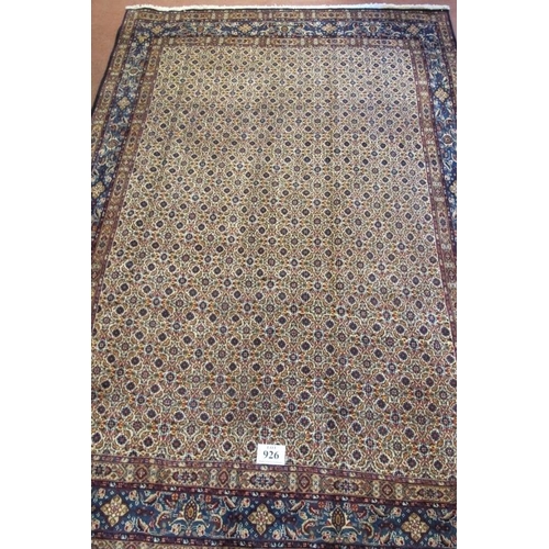 926 - A lovely Persian Mood carpet. Central block repeat pattern design, blue, red, brown and in very good... 