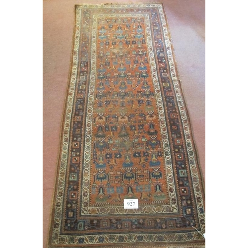 927 - An early-mid 20th century Persian rug - shabby chic look. Some wear to edging and repair needed to c... 