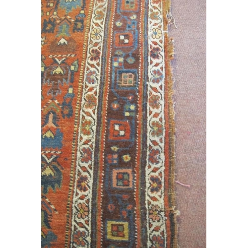 927 - An early-mid 20th century Persian rug - shabby chic look. Some wear to edging and repair needed to c... 