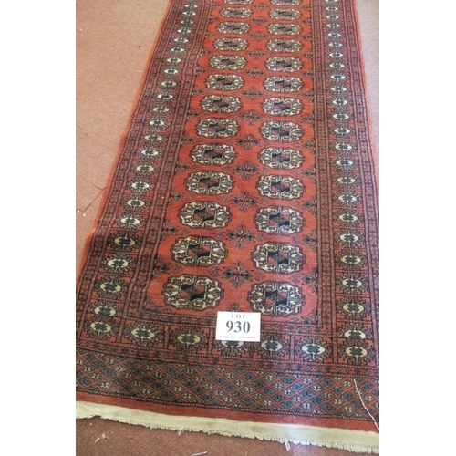 930 - A late 20th century Persian runner repeat central pattern on red ground - condition good. 433cm x 80... 