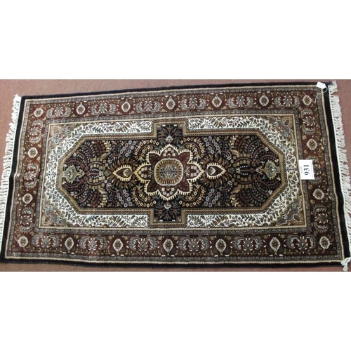 931 - A fine quality 20th century Persian part silk rug, a detailed foliage centre panel, brown on cream. ... 