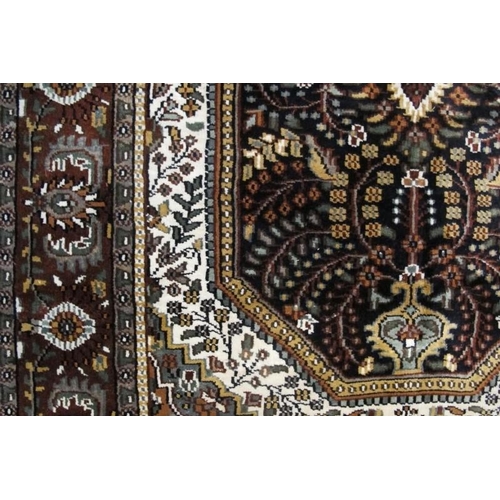 931 - A fine quality 20th century Persian part silk rug, a detailed foliage centre panel, brown on cream. ... 