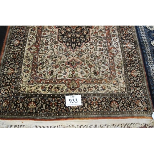 932 - A 20th century part silk Persian rug central motif on fawn ground. Clean rug. 175cm x 108cm.