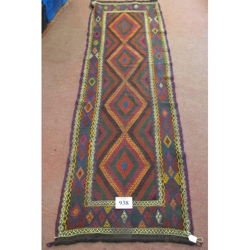 938 - A 20th century Kilim rug, colourful, central diamond motifs and in good condition. 250cm x 80cm.