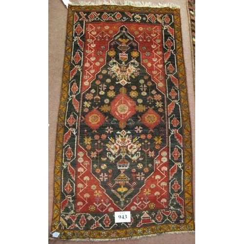 943 - A fine mid 20th century Baluch rug with stylized floral motifs on claret 4 charcoal field. 1.72cm x ... 