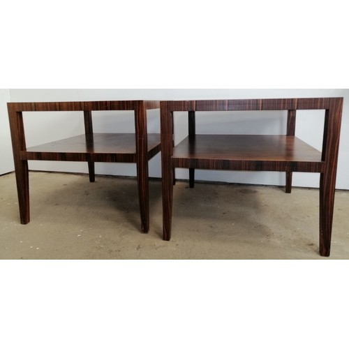 702 - A pair of mid-century coromandel two-tier side tables, on tapering square supports. 
H64 W80 D70
Con... 