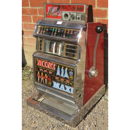 710A - A vintage Jubilee 'Riviera' chromed one-armed bandit penny slot machine. Includes vintage coins. 
H7... 