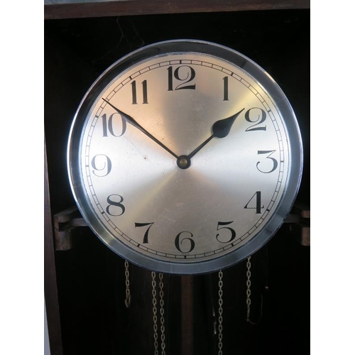 725 - An Art Deco Period oak cased Westminster chiming longcase clock, having a three weight driven moveme... 