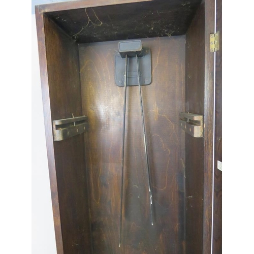 725 - An Art Deco Period oak cased Westminster chiming longcase clock, having a three weight driven moveme... 