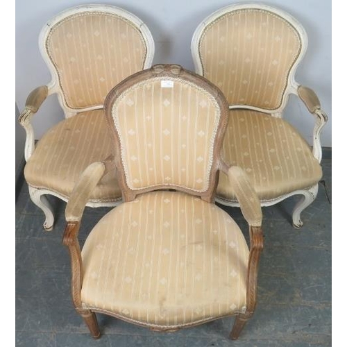 748 - A pair of antique French open-sided armchairs in the Louis XV taste, painted white and distressed, u... 