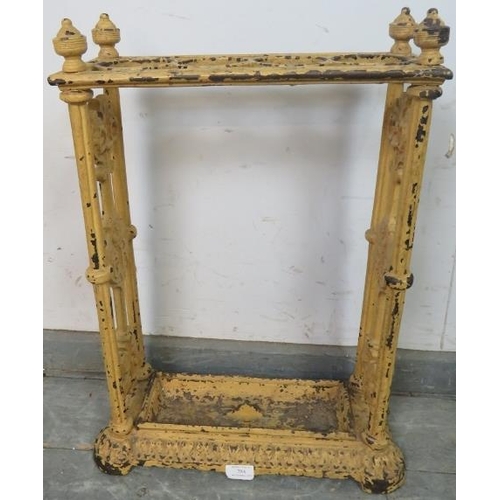 784 - An early 20th century cast iron umbrella stand in the manner of Coalbrookdale, painted ochre, the fi... 