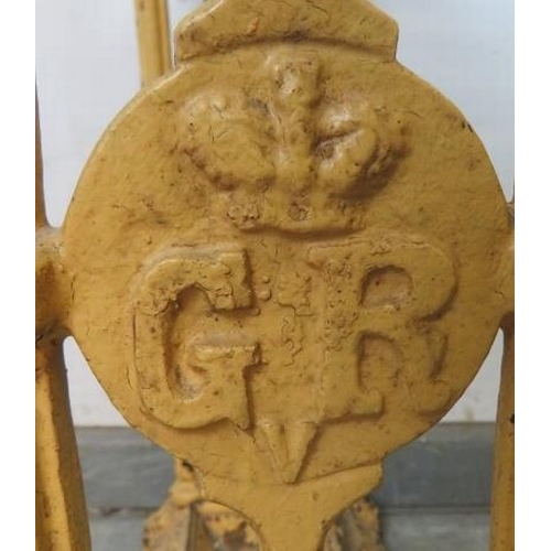 784 - An early 20th century cast iron umbrella stand in the manner of Coalbrookdale, painted ochre, the fi... 