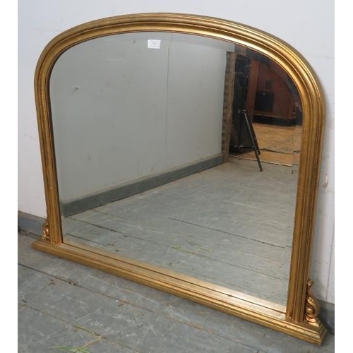 854 - A vintage 19th century style bevelled overmantle mirror, within an arched giltwood frame with acanth... 