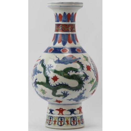 10 - A Chinese Wucai decorated porcelain vase, 20th century. Of pear shaped form with a flared cylindrica... 