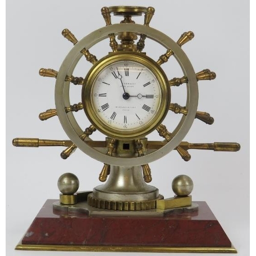 109 - A French ship’s helm marine presentation clock, Paris, 19th century. Modelled as a twelve spoke doub... 