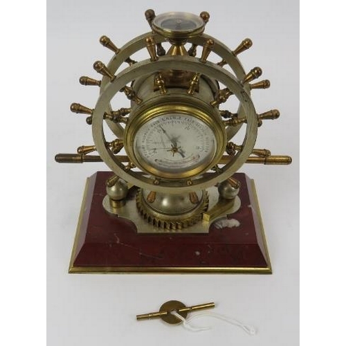 109 - A French ship’s helm marine presentation clock, Paris, 19th century. Modelled as a twelve spoke doub... 