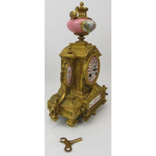 114 - A French ormolu and painted porcelain mantle clock, 19th century. Modelled in the Neoclassical style... 