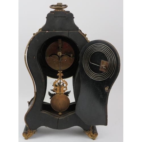 115 - A large French gilt metal mounted and ebonised wood mantle clock, 19th century. With enamelled Roman... 