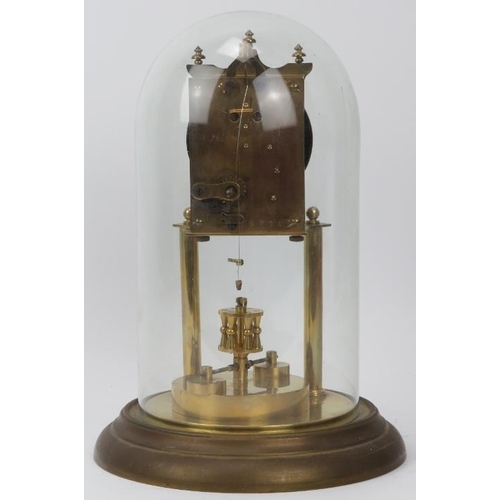 119 - A gilt metal and brass 400 Day Anniversary torsion pendulum clock with glass dome, early 20th centur... 