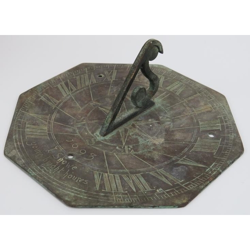 12 - A William and Mary period bronze sundial, late 17th century. The octagonal plate with angular S scro... 